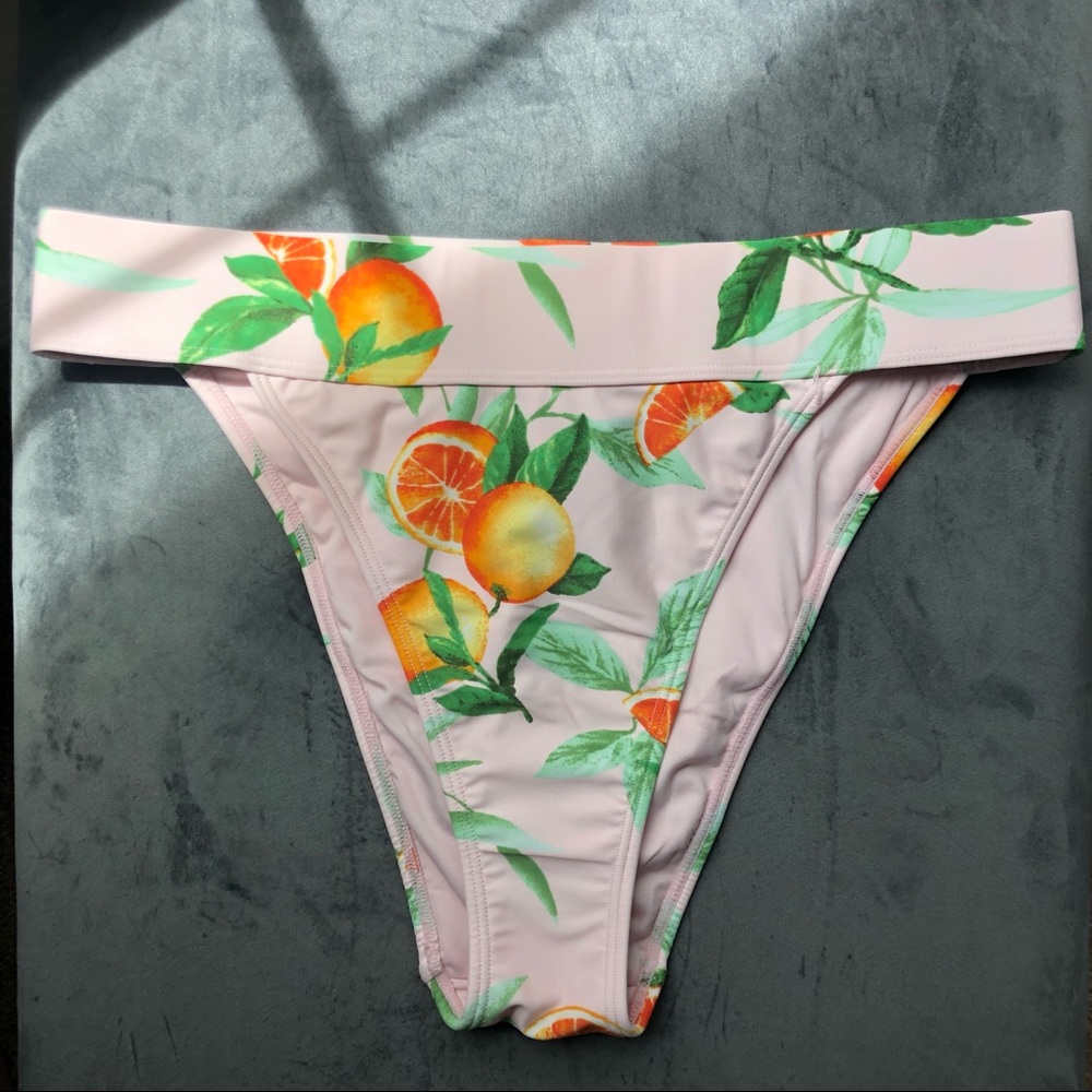 Light pink bikini bottom with orange fruit print